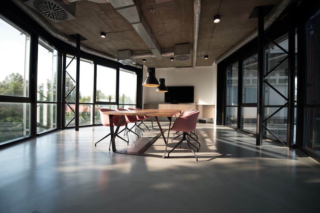Modern tech company office interior with open workspace and large windows